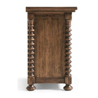 Side view of wooden nightstand with detailed legs.