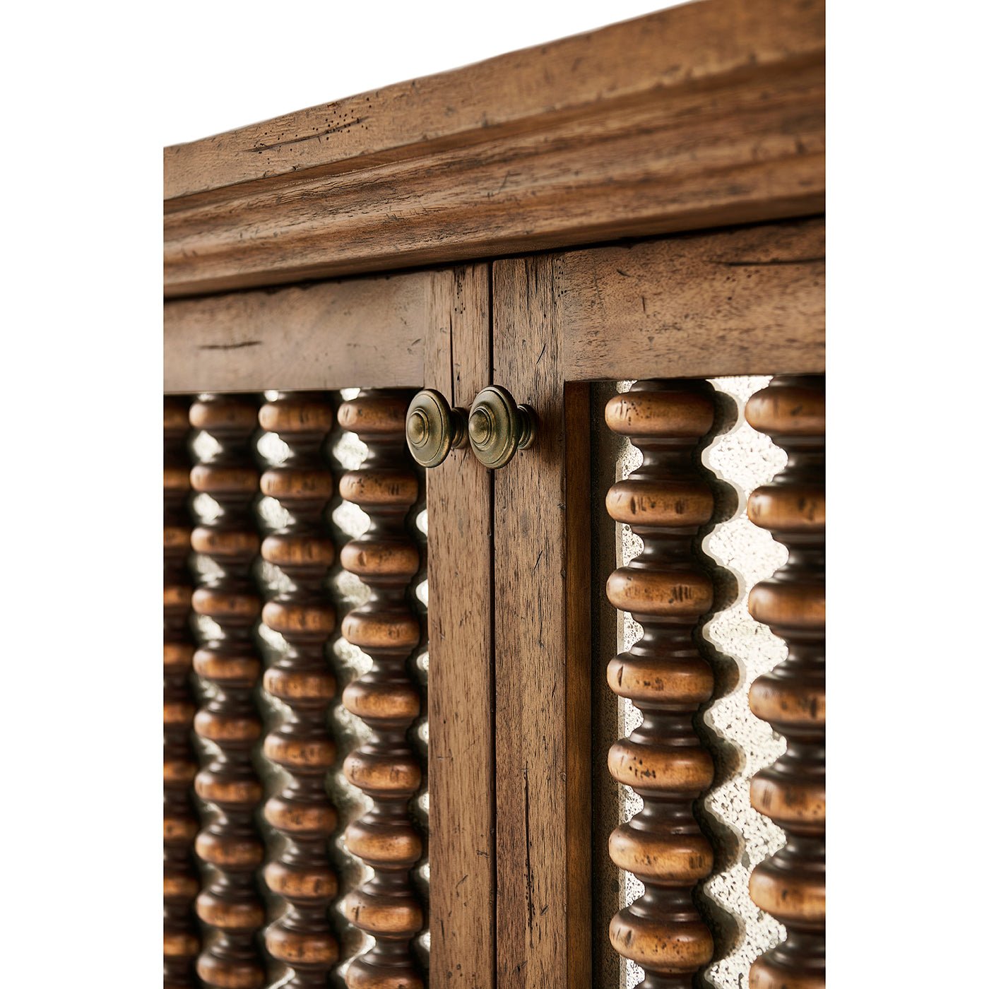 Detailed view of console's intricate spindle pattern.