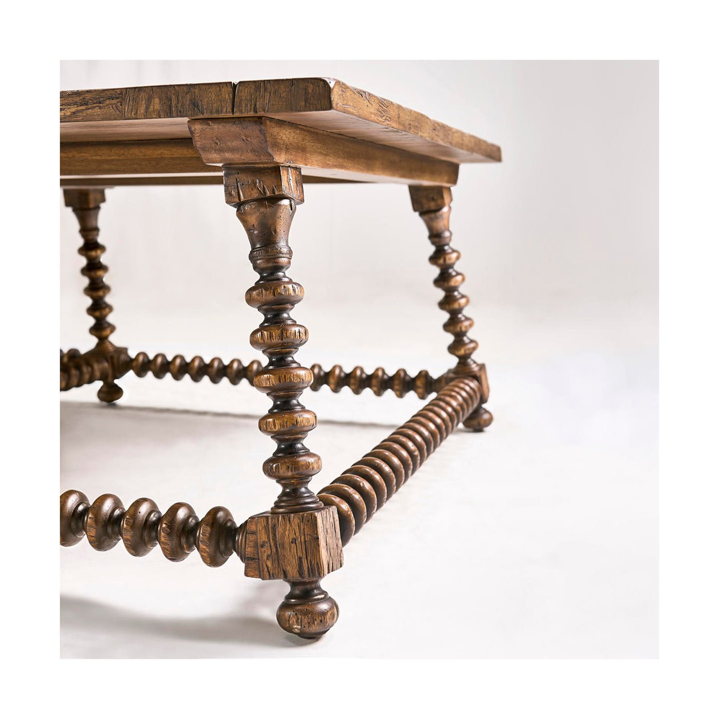 Close-up of detailed bobbin-turned legs on rustic coffee table.