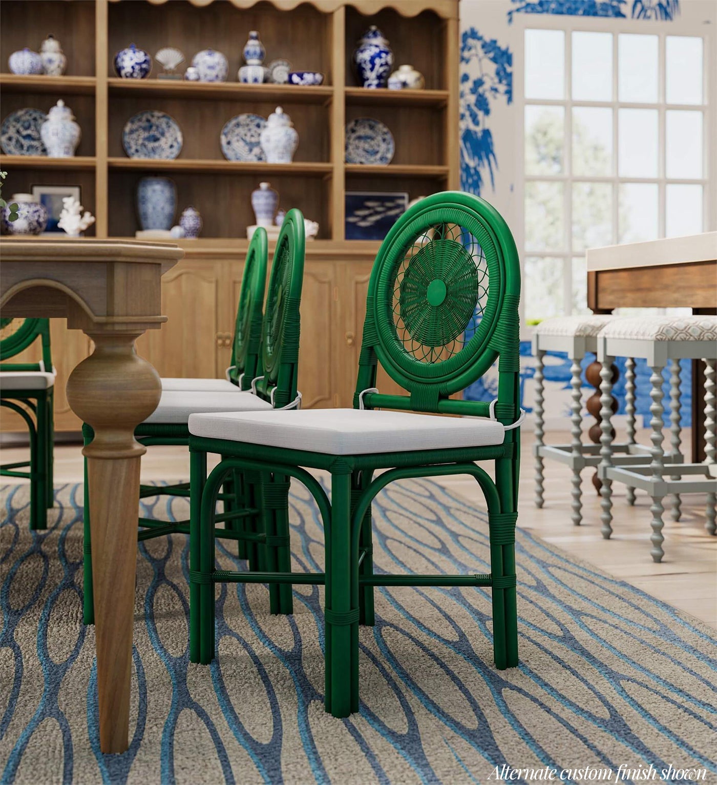 Green rattan chairs in blue-themed dining room.
