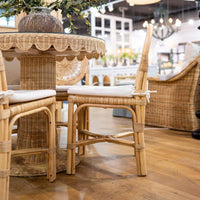 Side profile of rattan chair in dining room.