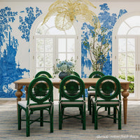 Set of green rattan chairs in stylish dining room.