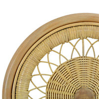 Detailed backrest design on rattan side chair.