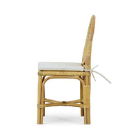 Rattan side chair side profile with cushion.