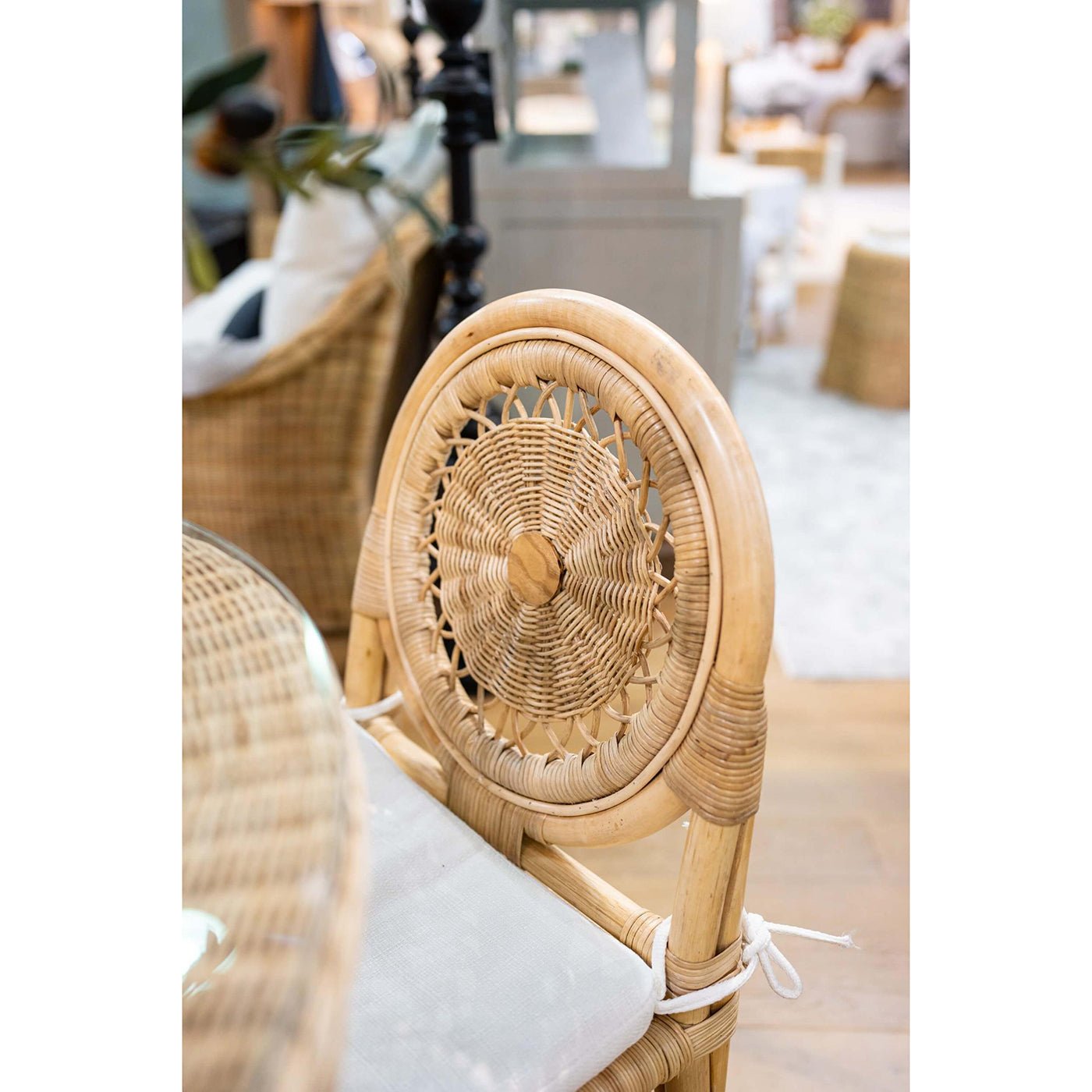 Top view of rattan chair backrest in dining space.