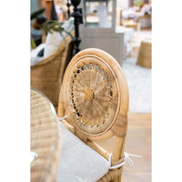 Top view of rattan chair backrest in dining space.