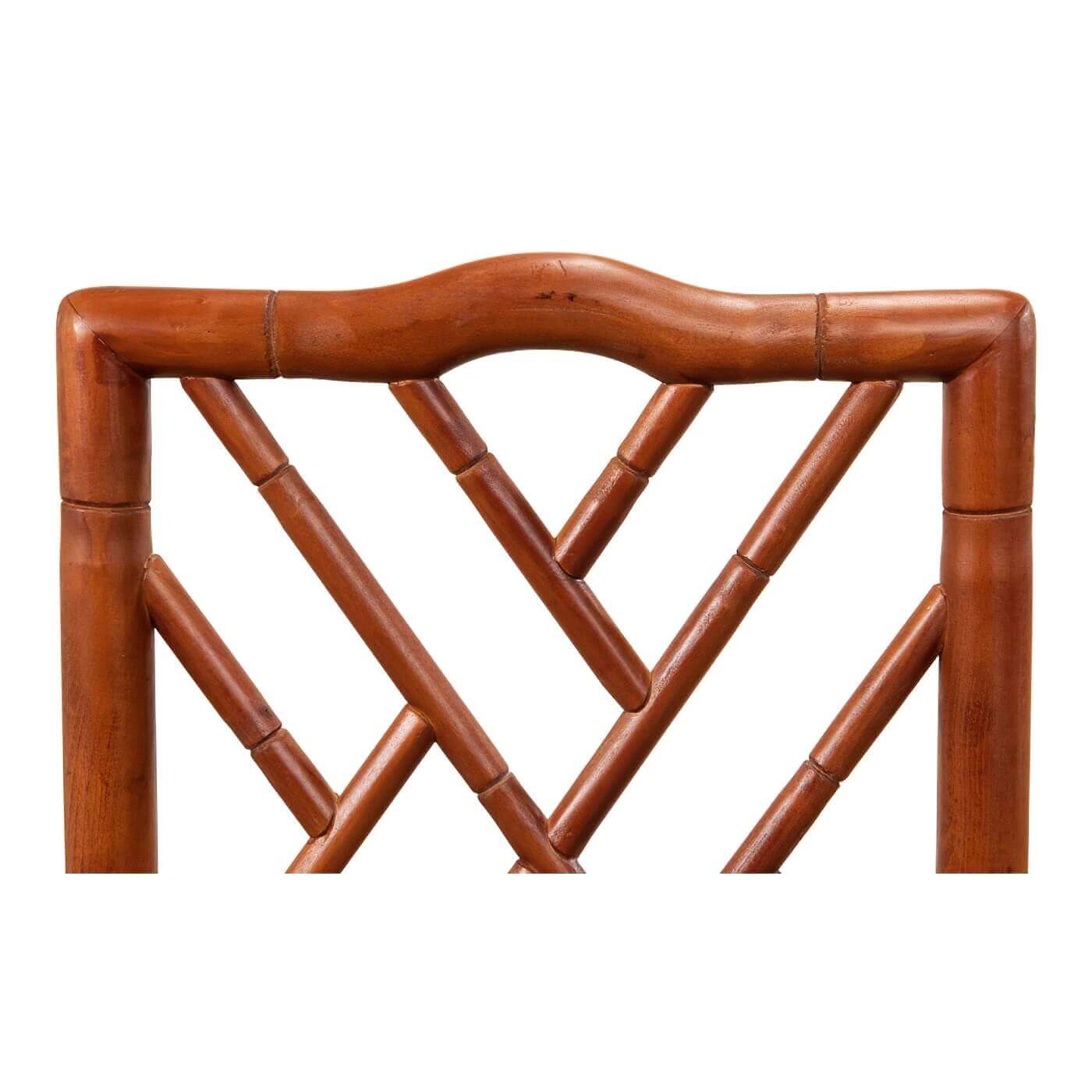Close-up of faux bamboo chair's lattice back.