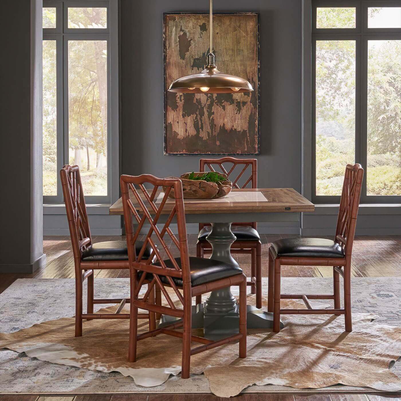 Dining room with faux bamboo side chairs around table.