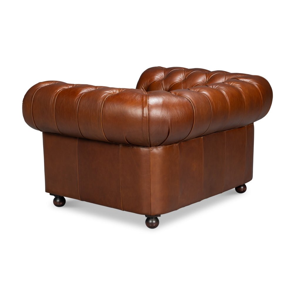 Angled back view, brown Chesterfield armchair, tufted leather