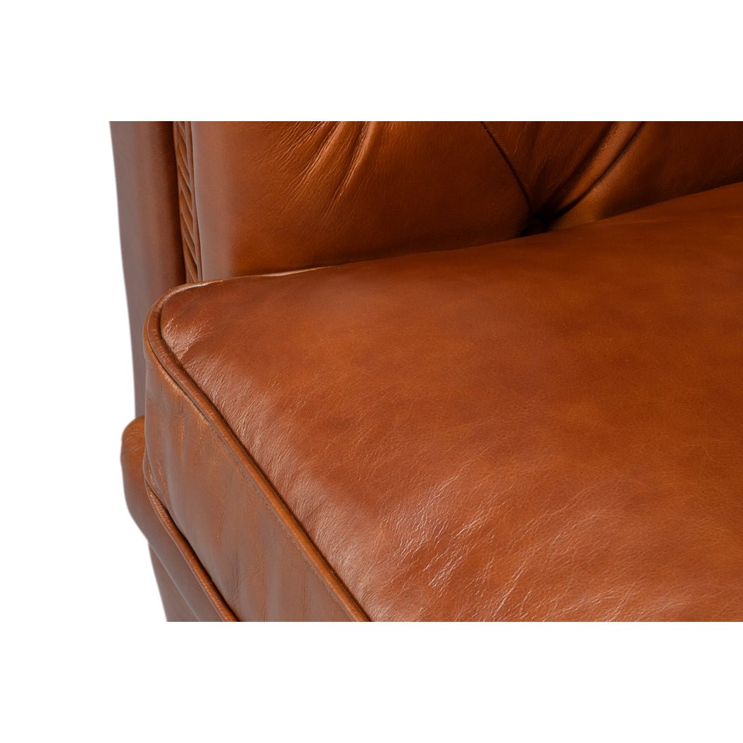 Close-up, cushion detail, brown leather Chesterfield armchair
