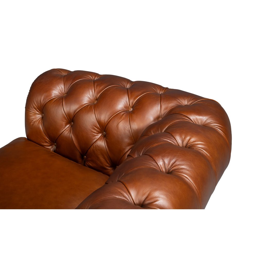 Chesterfield sofa, overhead view, detailed tufted armrest.