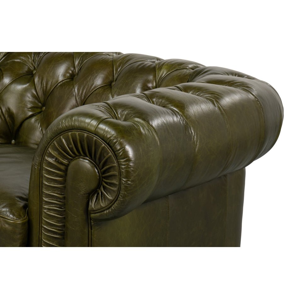 Close-up, side view of rolled arm, tufted leather.