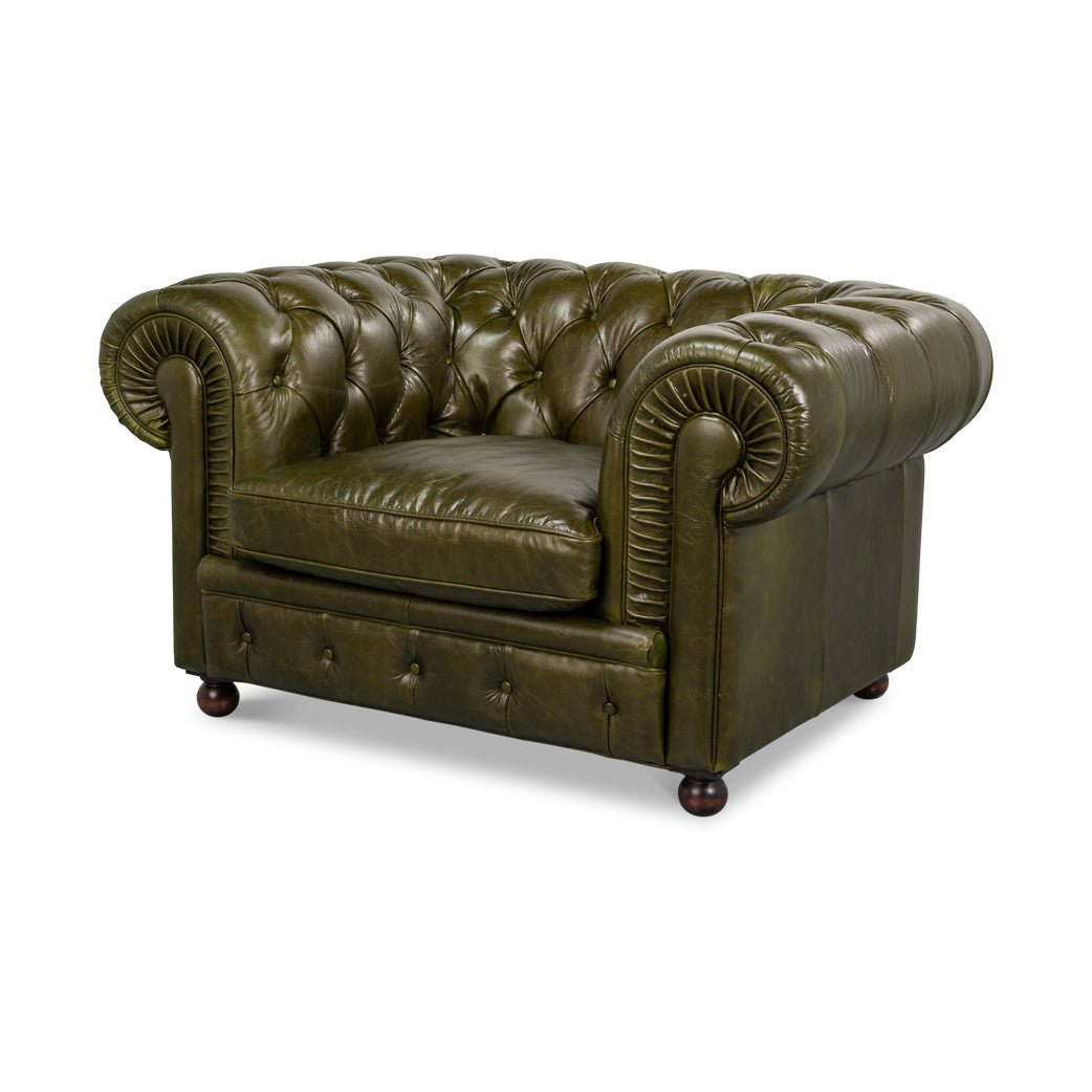 Green leather armchair, angled front view, tufted design.