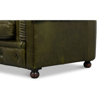 Close-up, side panel and leg detail, green leather.