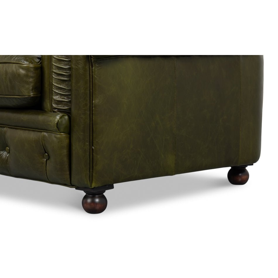 Close-up, side panel and leg detail, green leather.