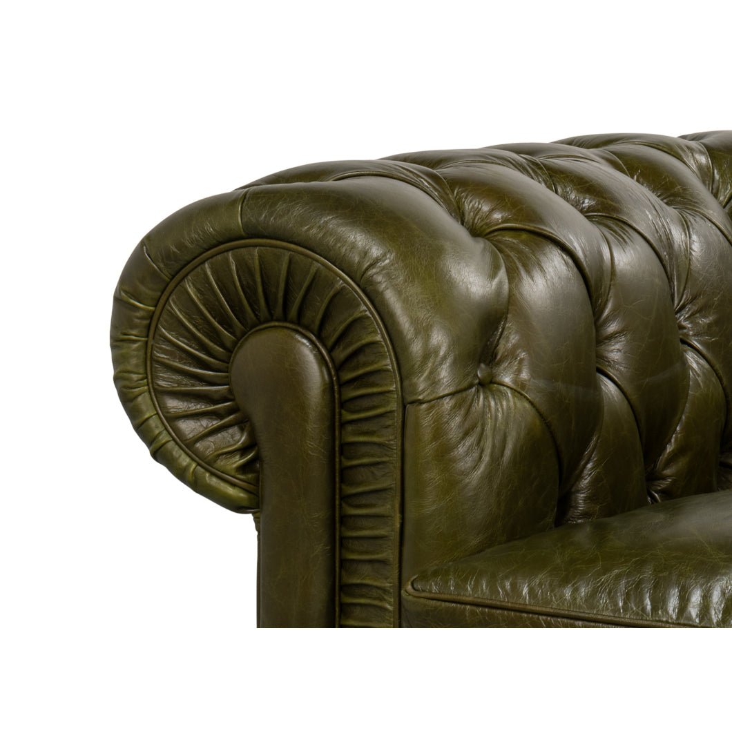 Close-up, rolled arm detail, green leather.