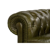 Close-up, rolled arm detail, green leather.