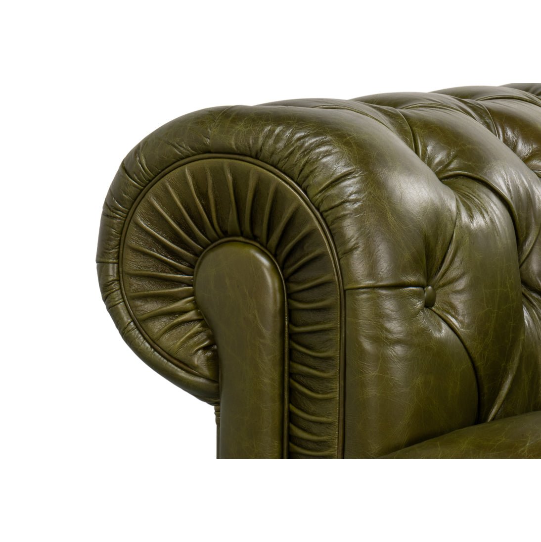 Armrest pleating detail, green leather Chesterfield sofa.