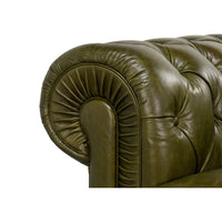 Armrest pleating detail, green leather Chesterfield sofa.