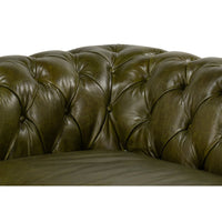 Button-tufting detail in corner of Chesterfield sofa.