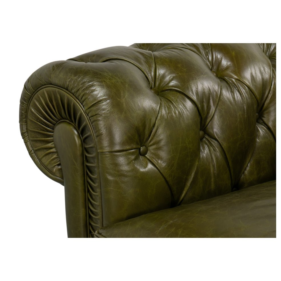 Rolled arm detail, green leather Chesterfield sofa close-up.