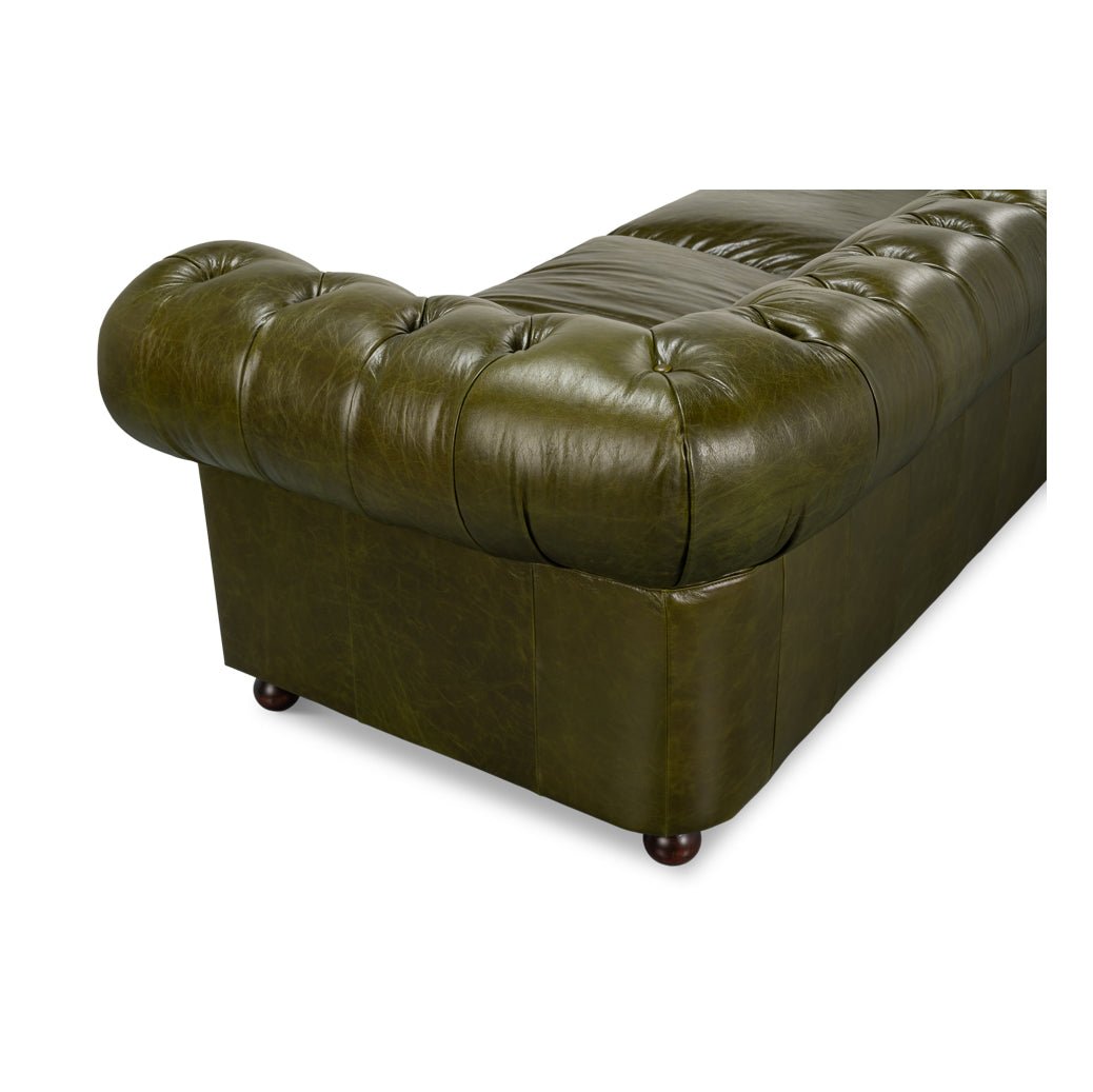 Rear corner perspective of green leather Chesterfield sofa.