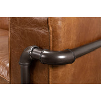 Detail of corner piping on industrial leather sofa.