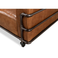 Side piping detail of industrial leather sofa.