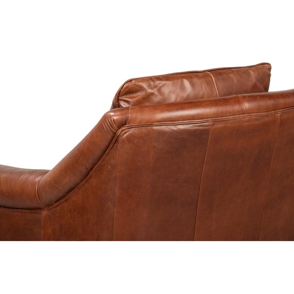 Close-up of back support detailing on leather accent chair.