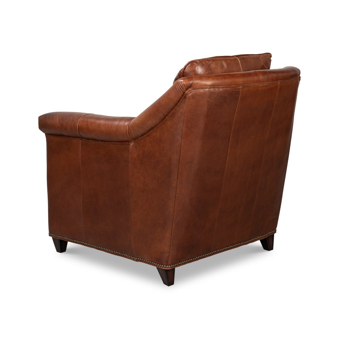 Angled back view of brown leather accent chair.