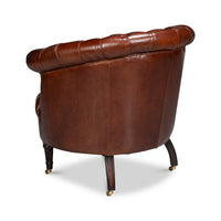 Brown leather barrel chair, back angle.