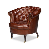 Brown leather barrel chair, front angle view.