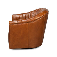 Side profile of tufted brown swivel chair.