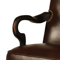 Close-up, chair armrest, wooden design with studs.