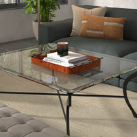 Brown leather tray on coffee table, room decor.