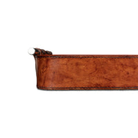 Side profile of brown leather tray, focus on edge.