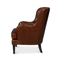Brown leather wing chair, side profile view.