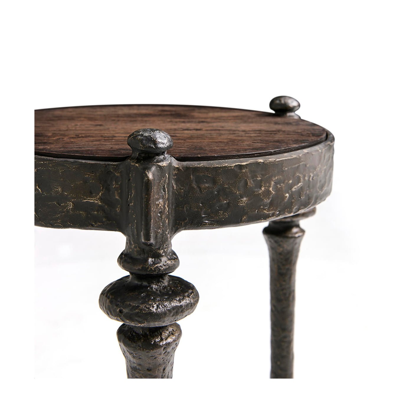 Detailed iron rim on round accent table surface.