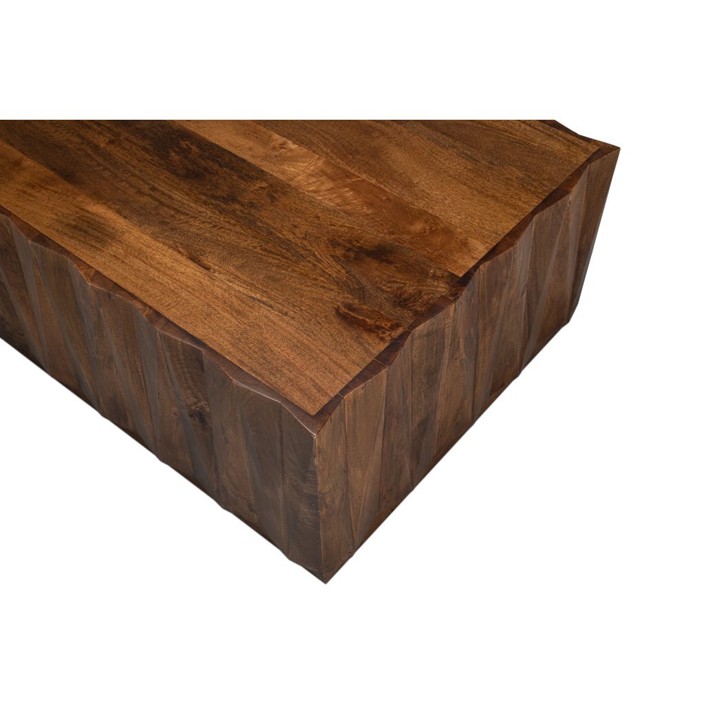 Corner view emphasizing wood grain of coffee table.