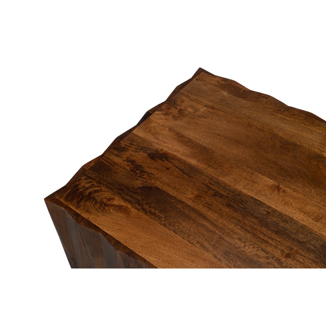Close-up of textured edge on wood coffee table.