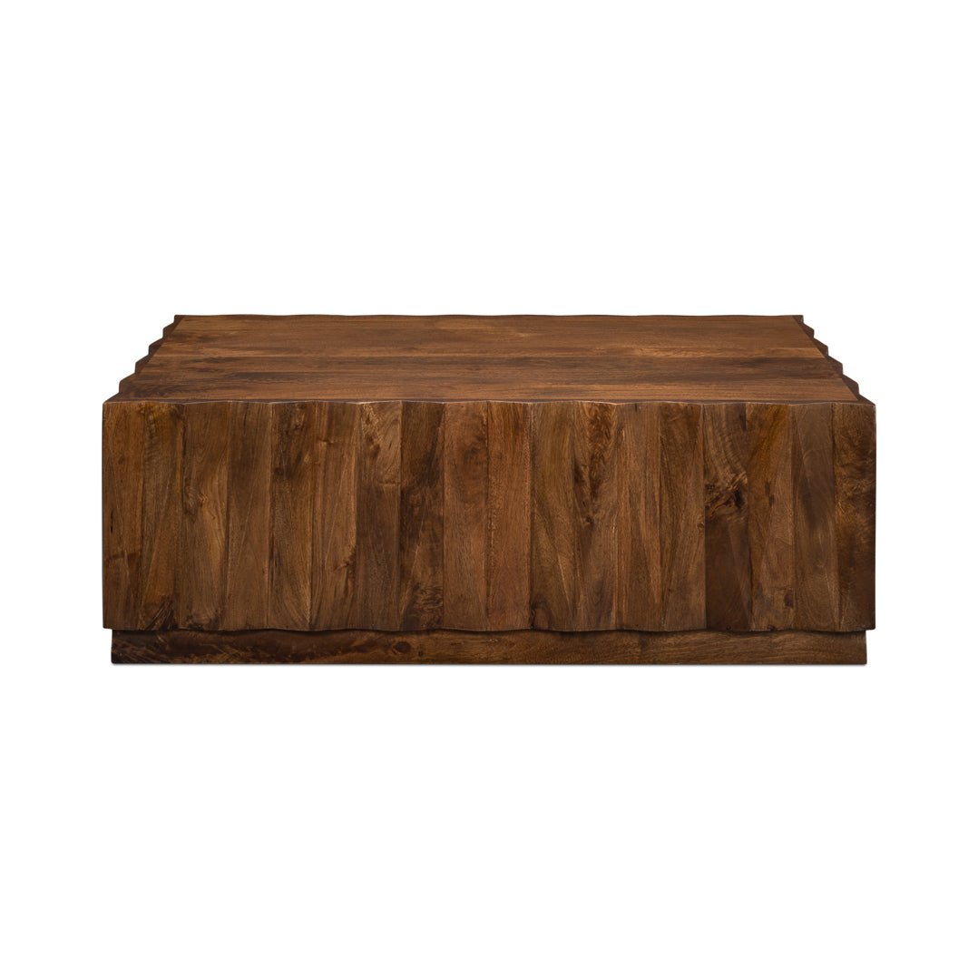 Straight-on view of textured wood coffee table.