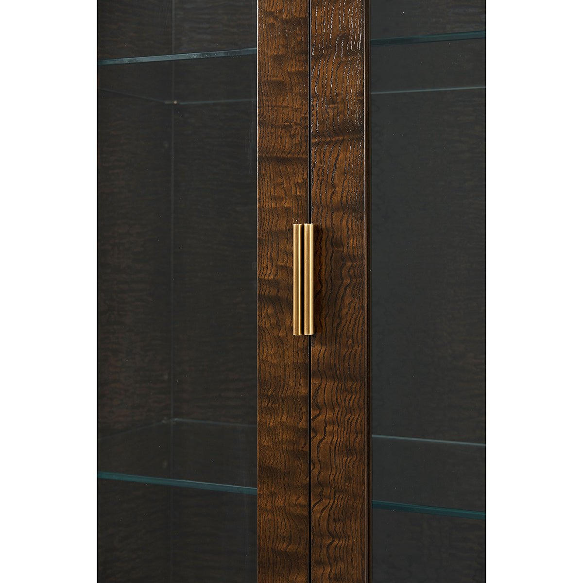 Close-up of burl art deco curio cabinet handle.