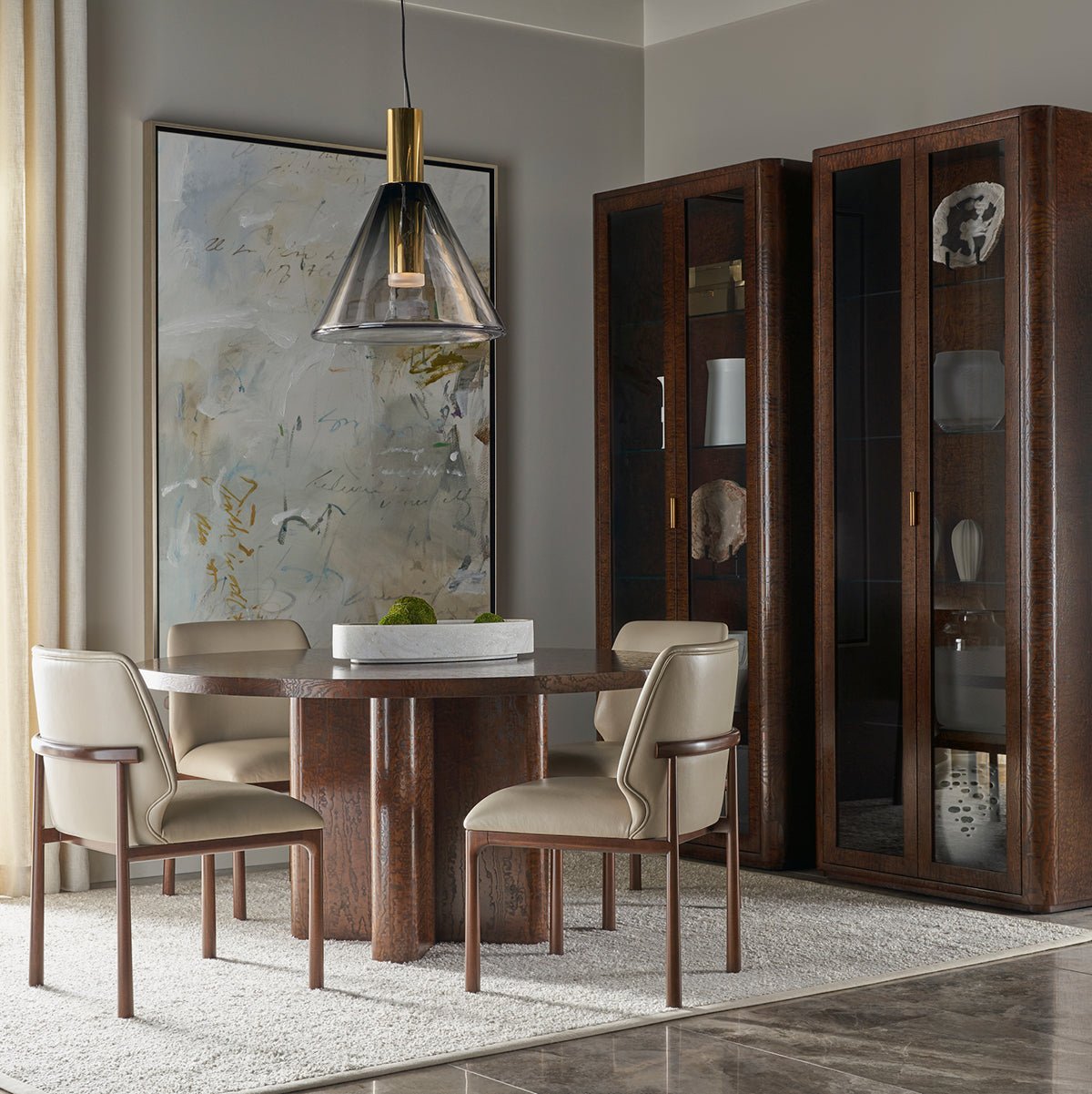 Elegant dining room featuring art deco curio cabinets.