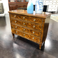 Burl wood chest angle view with vases.