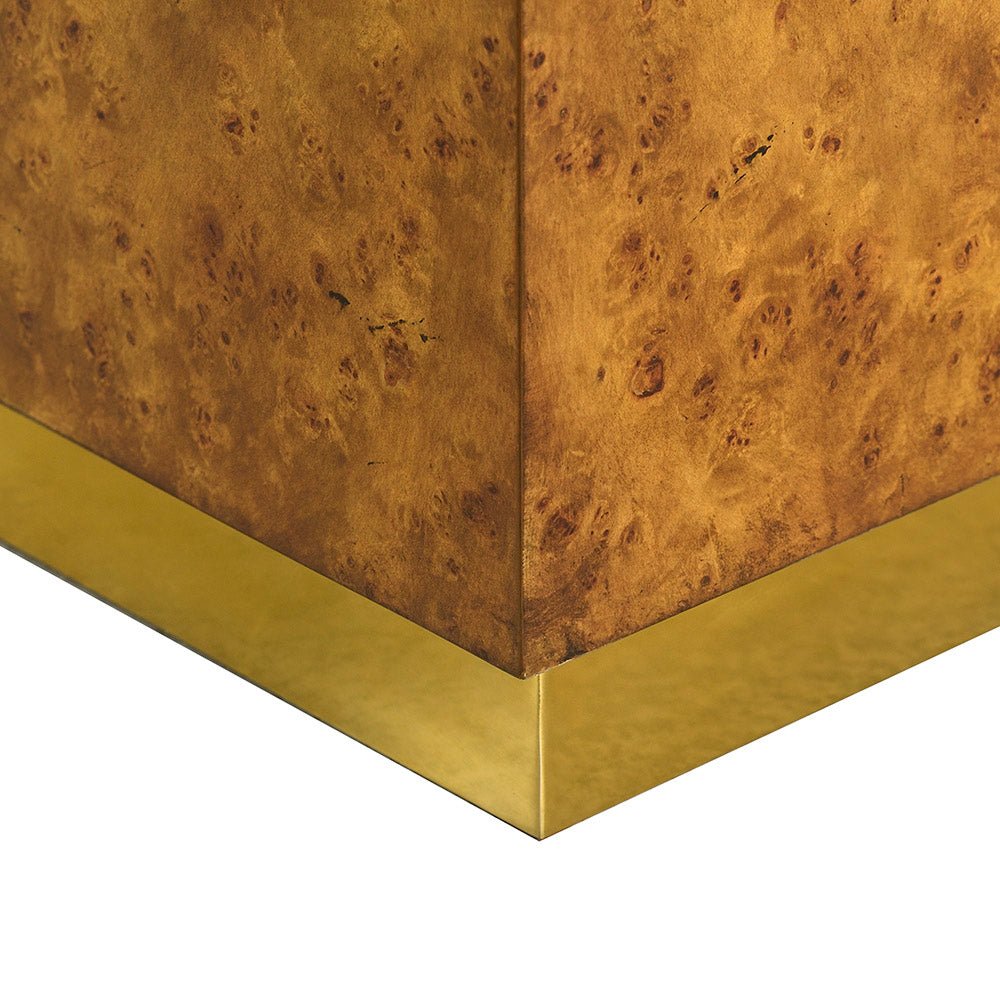 Gold base detail on burl wood cube table.