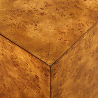 Close-up of burl wood texture on table corner.