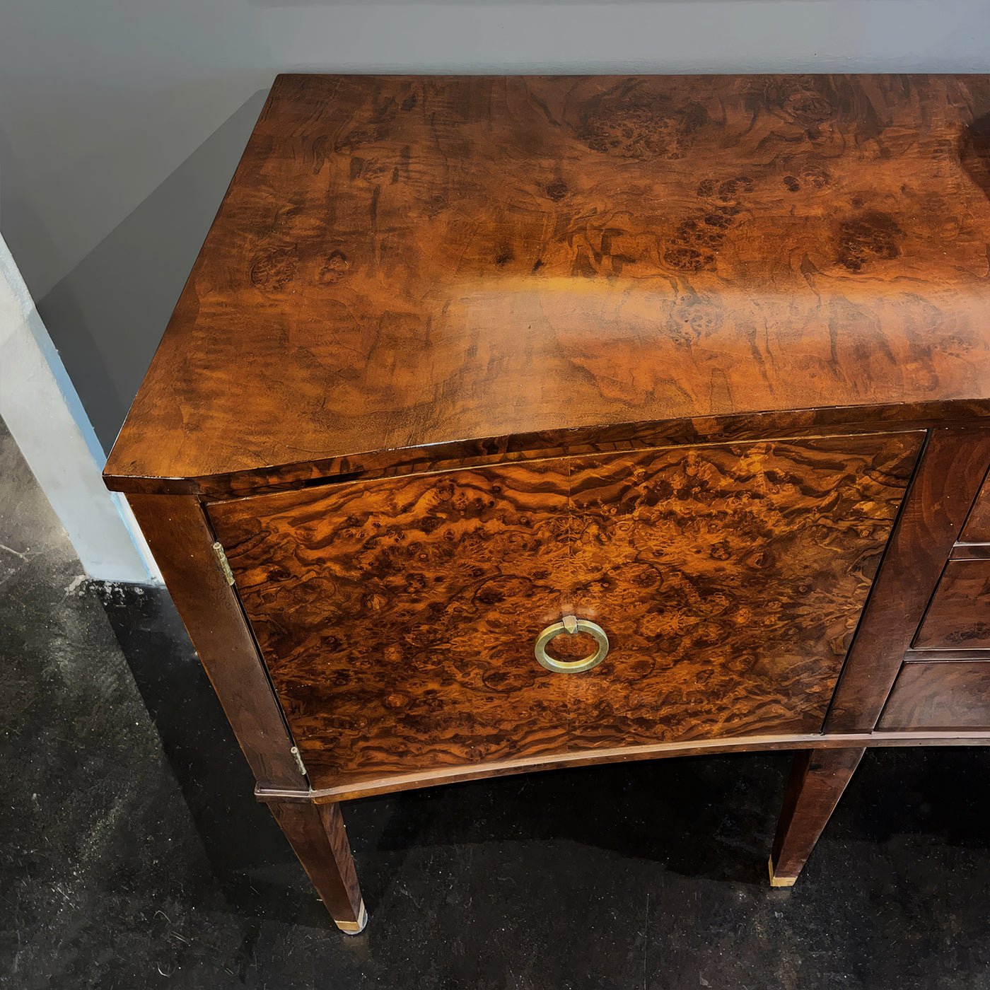 Burl wood sideboard top and cabinet door, detailed finish.