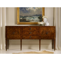 Burl wood sideboard in elegant room setting, painting above.