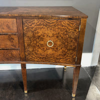 Close-up of burl wood sideboard cabinet door and pull.