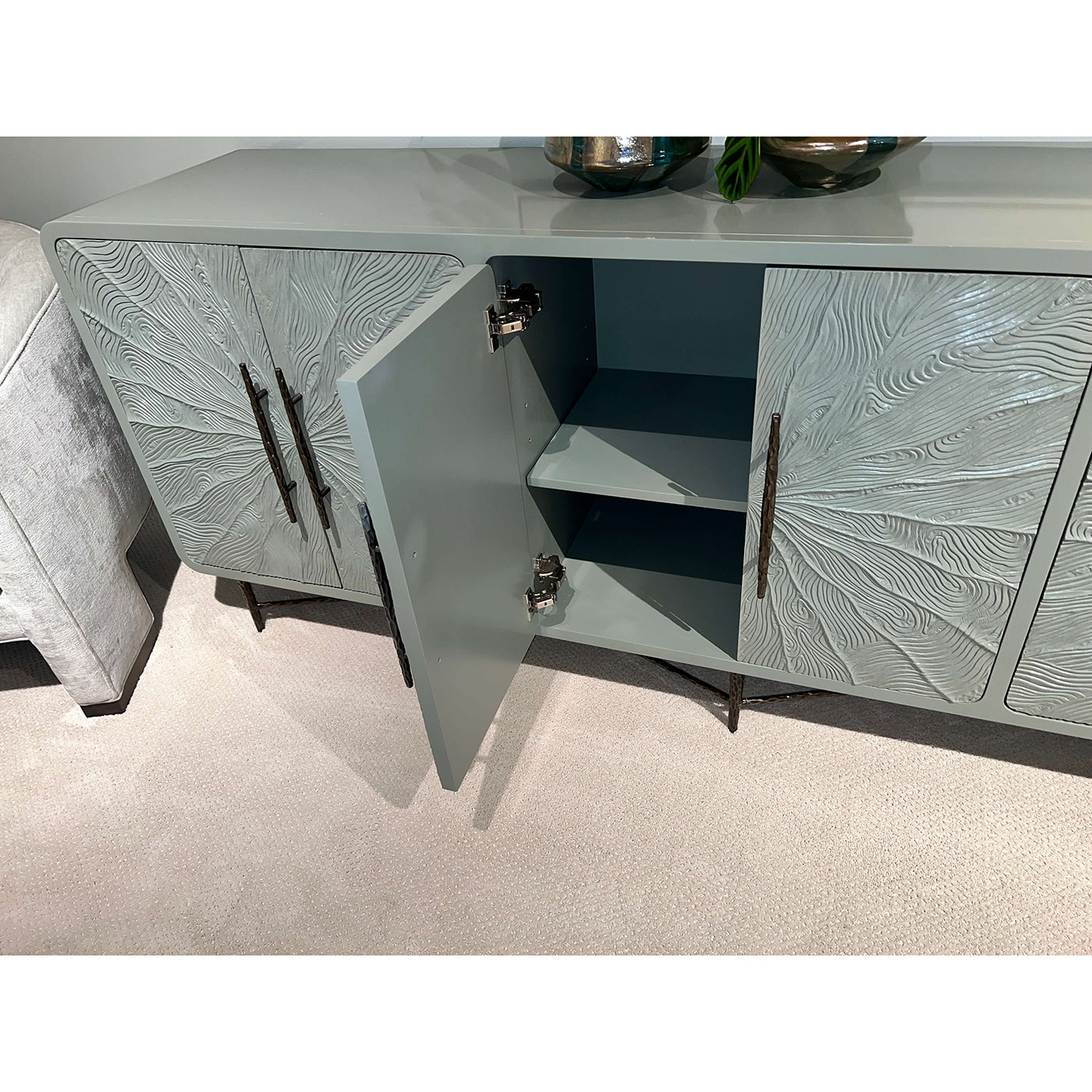 Open media cabinet showing interior shelves.